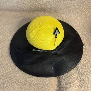Yellow and black wide brim straw hat